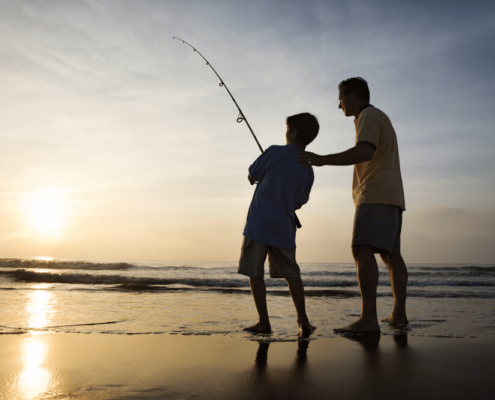 A picture of two people fishing on Tybee Island Public Beach.