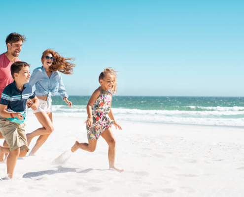 A family enjoying their Georgia spring break on Tybee Island beach