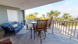 The deck at a Tybee Island vacation rental, perfect for breakfast during a romantic getaway.