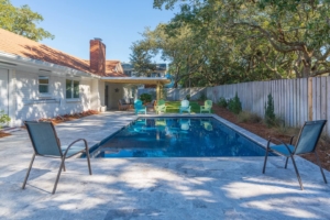 The backyard pool of a Tybee Island rental to relax by after shopping.