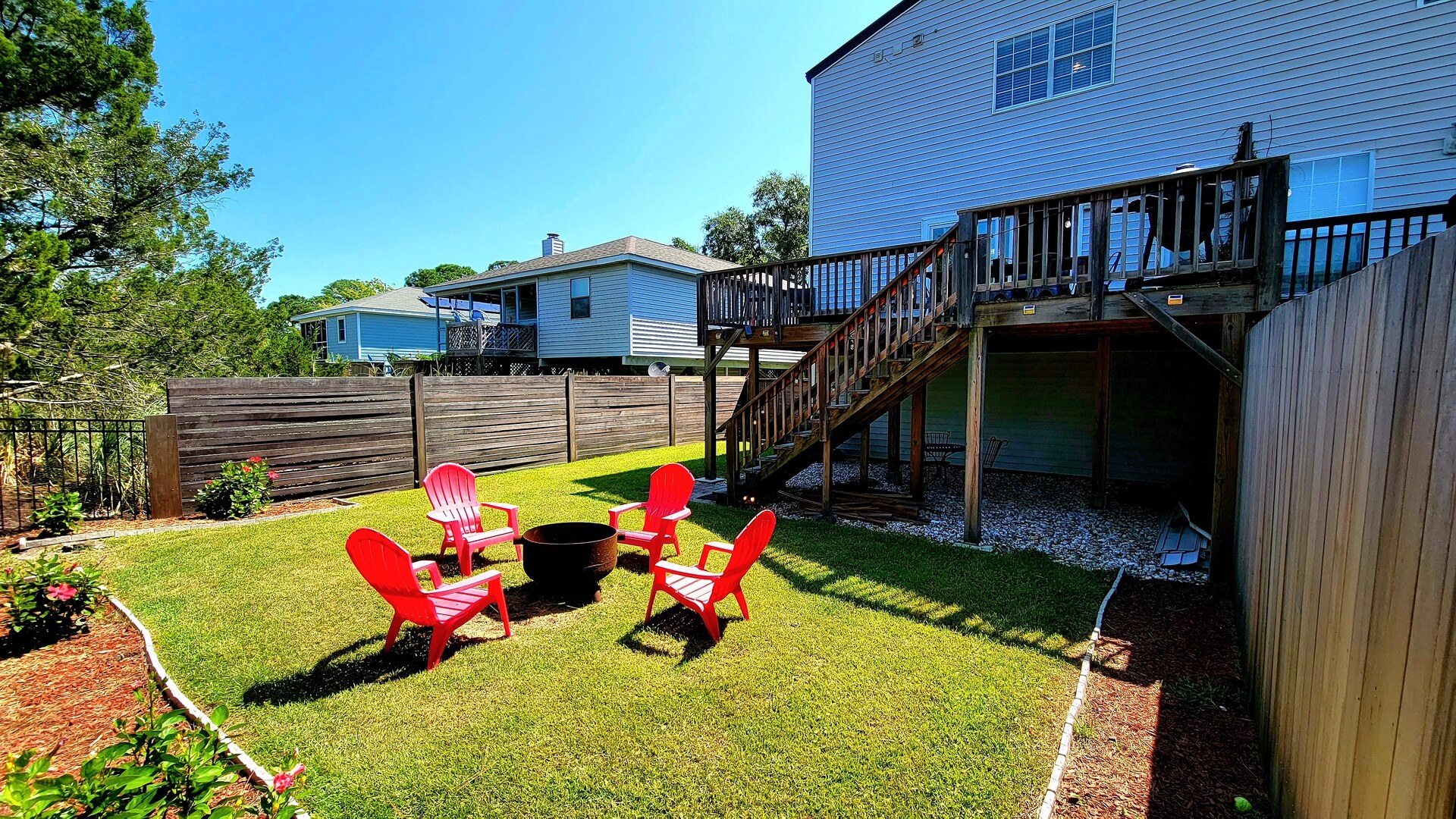 The backyard of a Tybee Island rental to relax in after exploring the Oatland Island Wildlife Center.