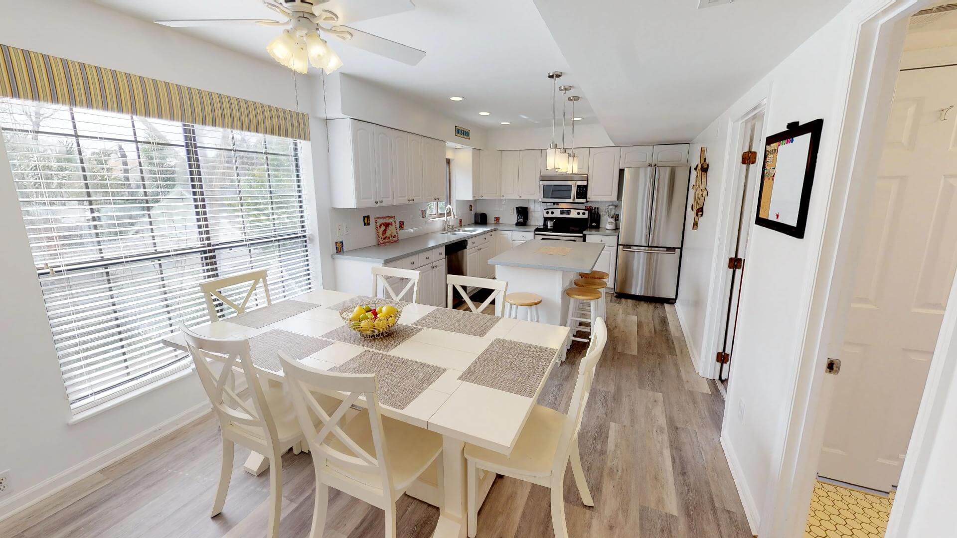 The kitchen and dining area of a Tybee Island rental to make Southern comfort food recipes in.