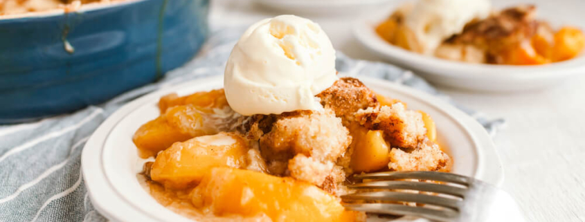 A dish of peach cobbler, a classic Southern comfort food.