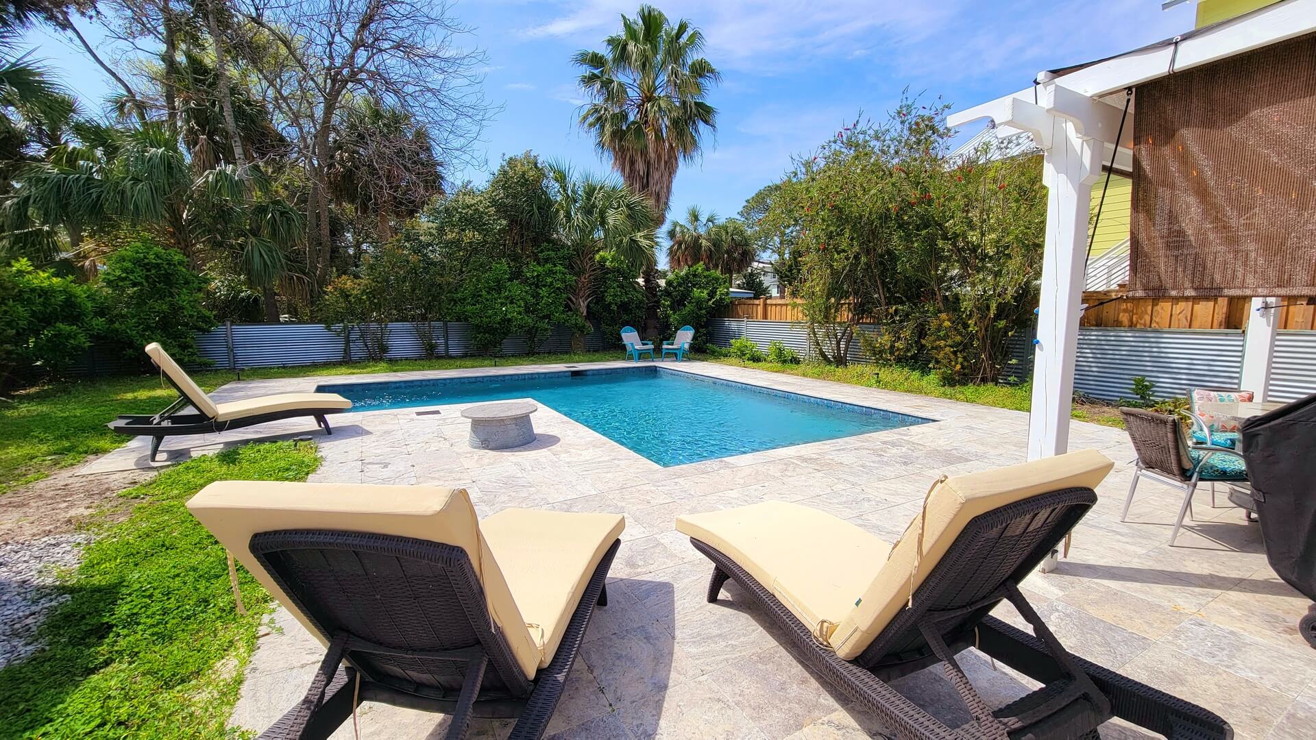 The pool area of a Tybee Island vacation rental to lounge in after exploring things to do on a solo trip.